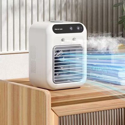 White portable air cooler on a wooden surface with steam rising