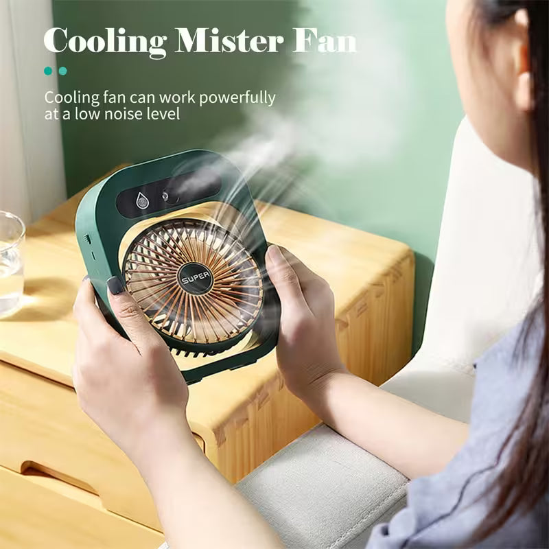 Person holding a small fan labeled 'Cooling Mister Fan' with text about its power and noise level.