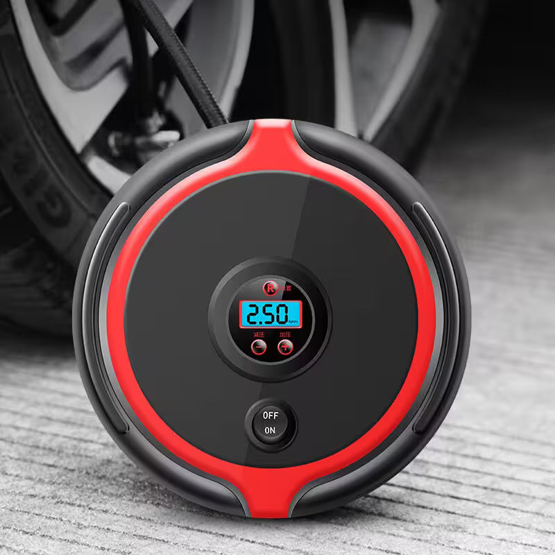 Red and black portable air compressor with digital display on a textured surface, car tire in the background
