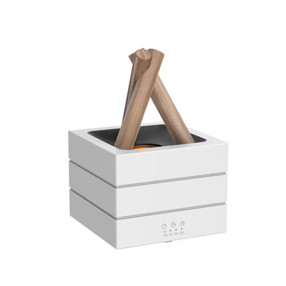 White fire pit with two wooden logs on a white background