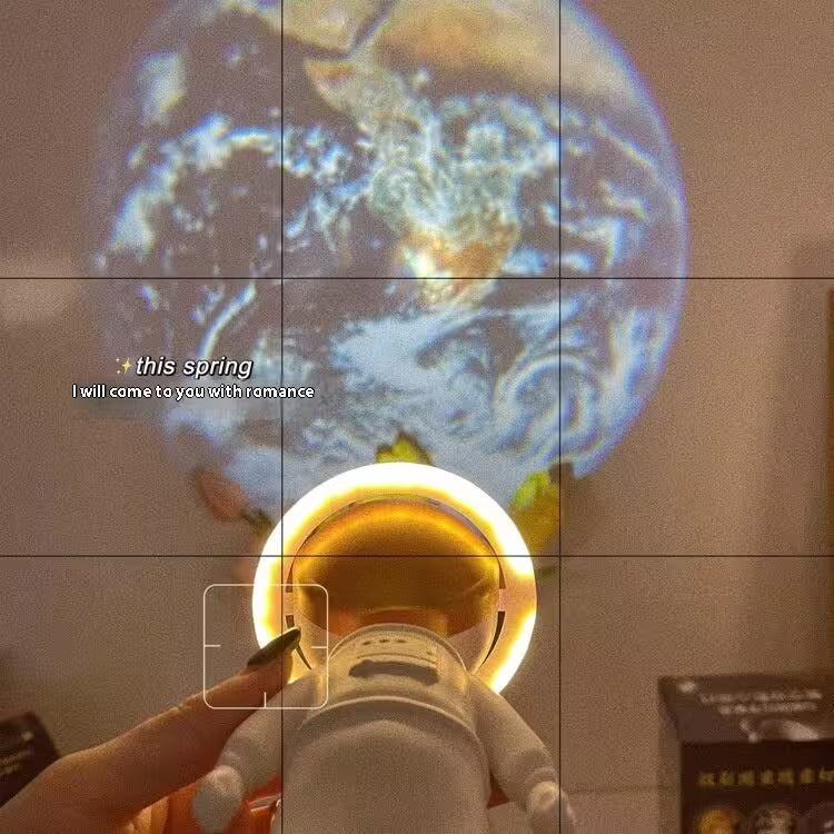 Projection of Earth onto a wall with a bottle of champagne being uncorked below.