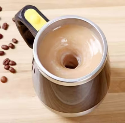 Coffee grinder with coffee beans on a wooden surface