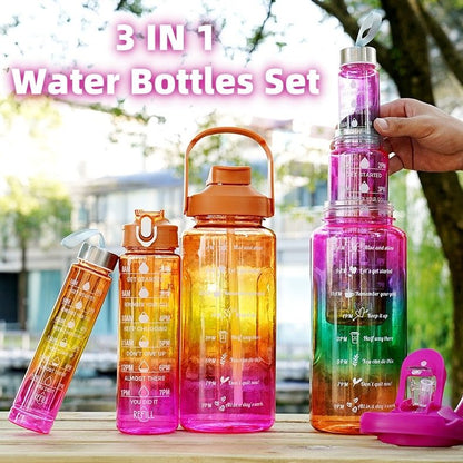 Set of three colorful water bottles with time markers on a wooden surface outdoors.