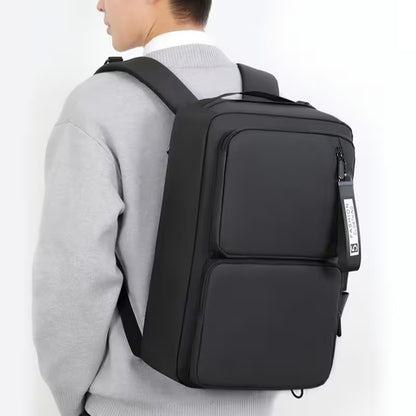Person wearing a black backpack on a white background