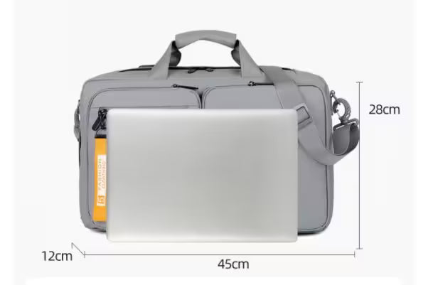 Gray shoulder bag with a laptop inside, showing dimensions on a white background
