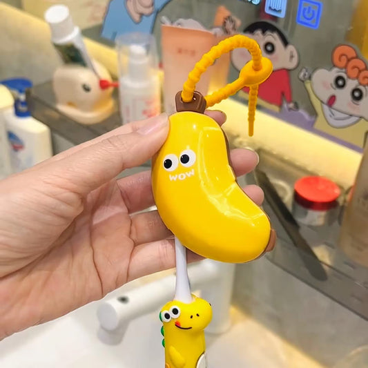 Hand holding a yellow banana-shaped toy with a face, against a background of cartoon characters.