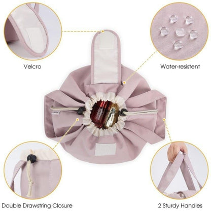 Pink drawstring bag with features highlighted on a white background