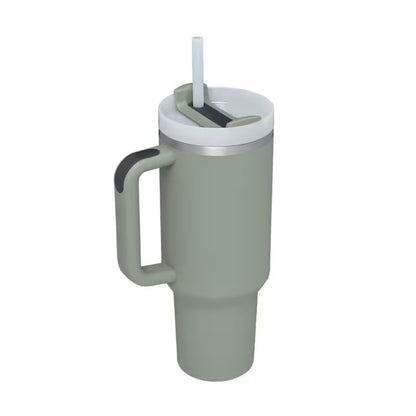Green insulated mug with handle and straw lid on a white background