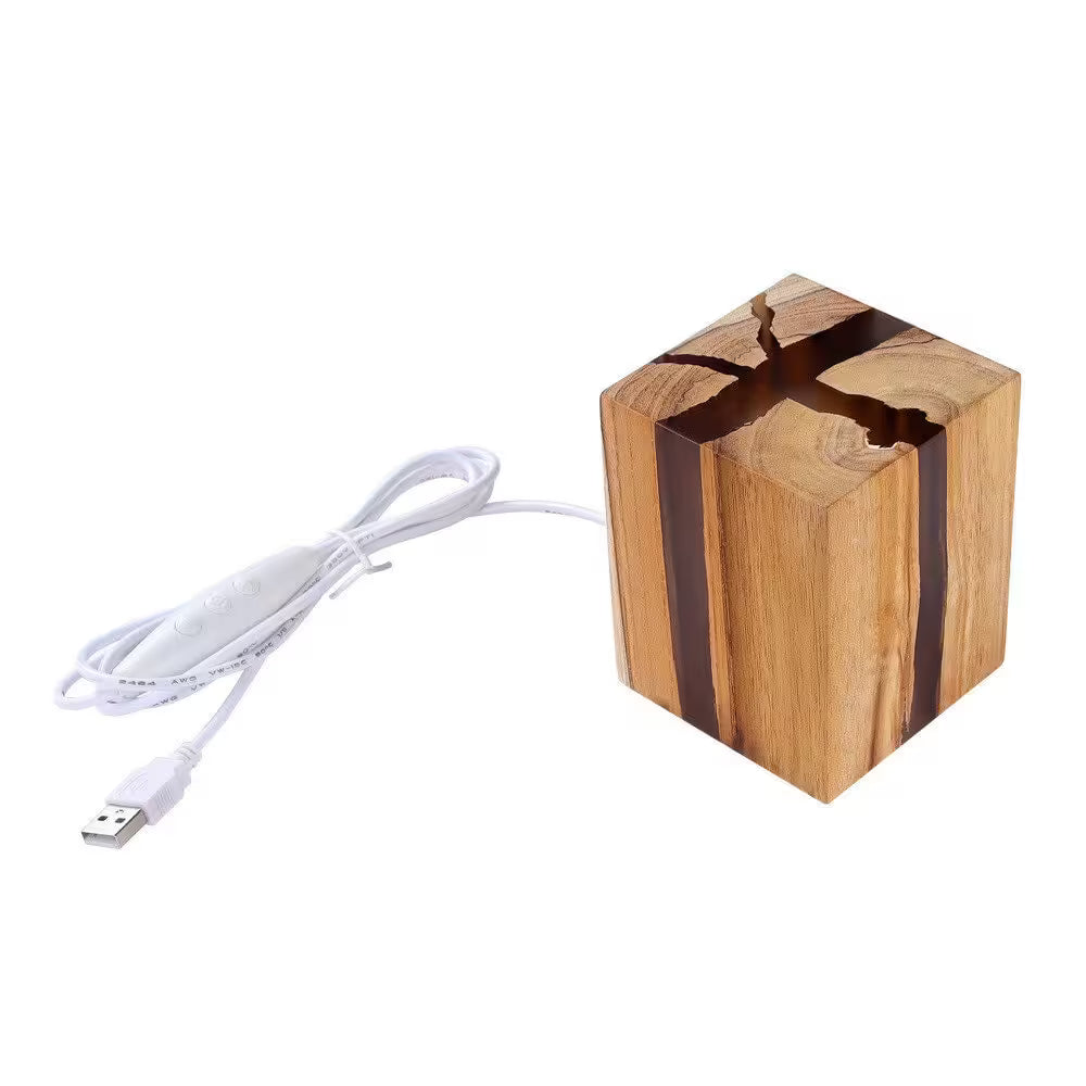 Wooden cube with a USB cable on a white background