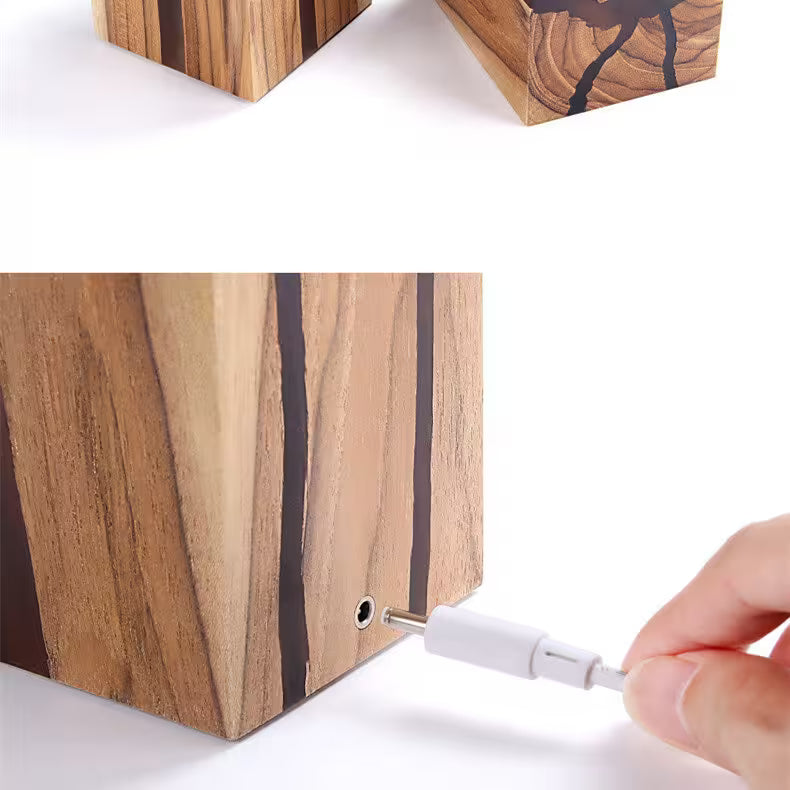 Wooden block with a screw being inserted into it, on a white background