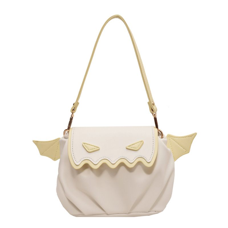 Beige handbag with gold accents on a white background
