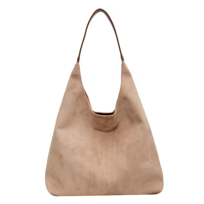 Beige handbag with a brown handle on a white background
