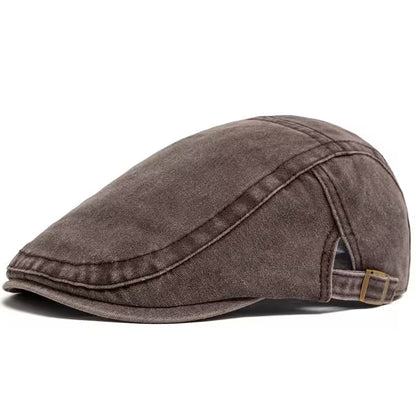 Brown flat cap on a white background