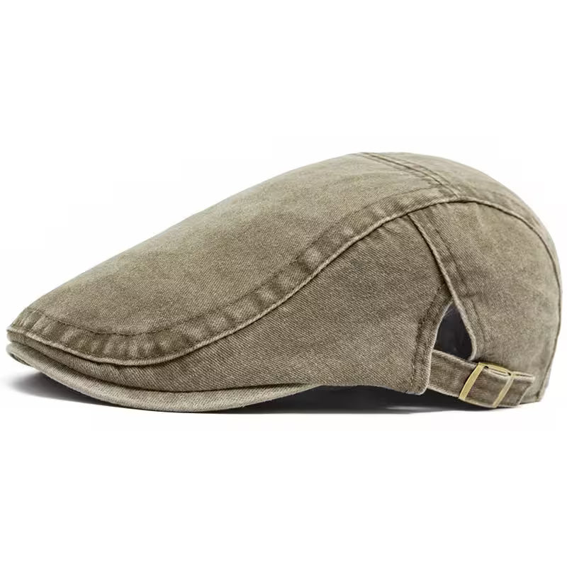 Brown flat cap with a strap on a white background