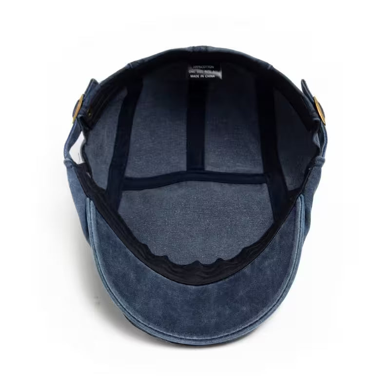 Blue suede cap with black interior on a white background