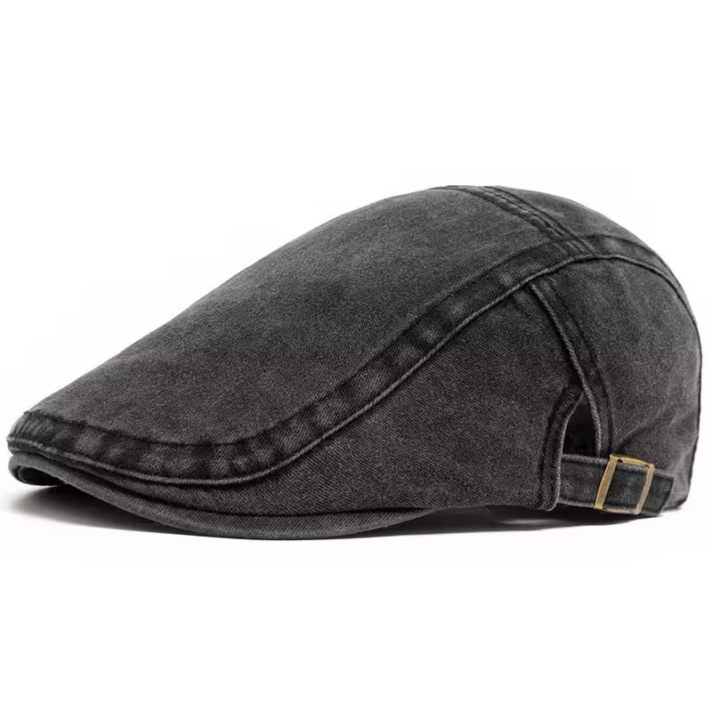 Black flat cap on a white background