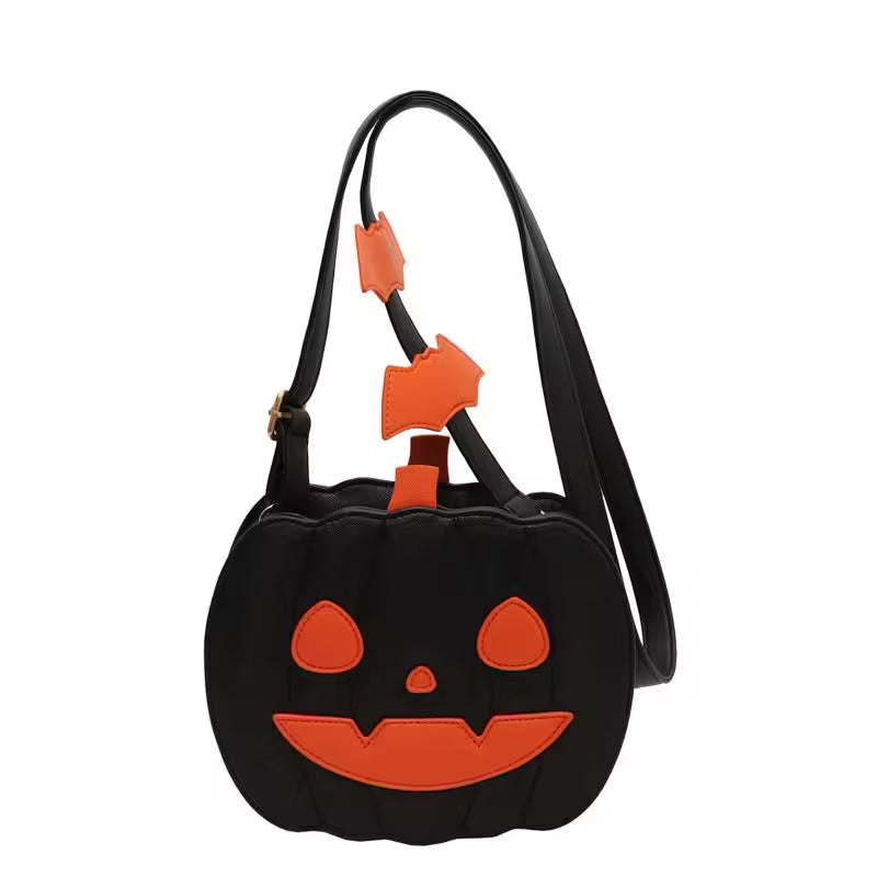 Black pumpkin-shaped bag with orange face details on a white background
