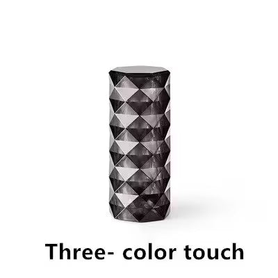 Tall cylindrical container with geometric pattern on a white background