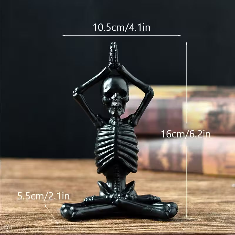 Black skeleton figurine on a wooden surface with measurements indicated.