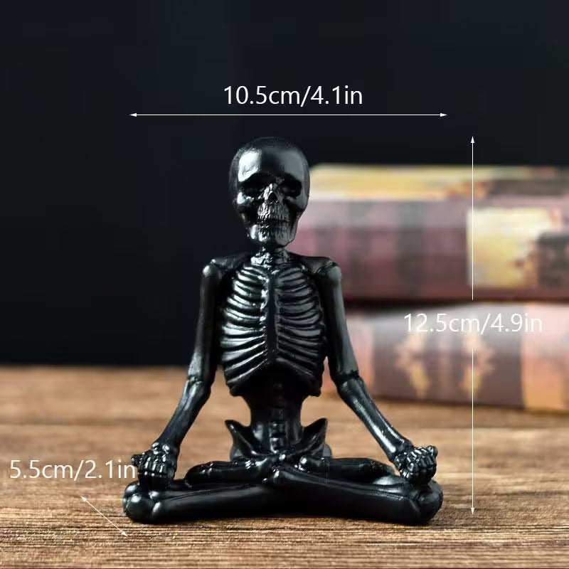 Black skeleton figurine with measurements on a wooden surface