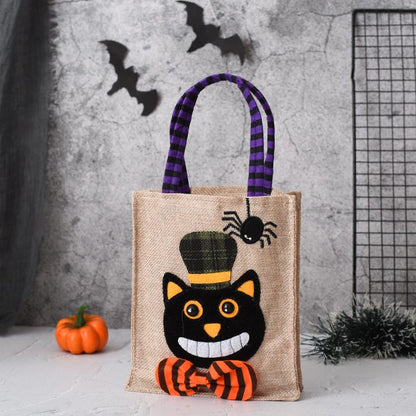 Halloween-themed jute bag with a black cat design against a gray textured background.