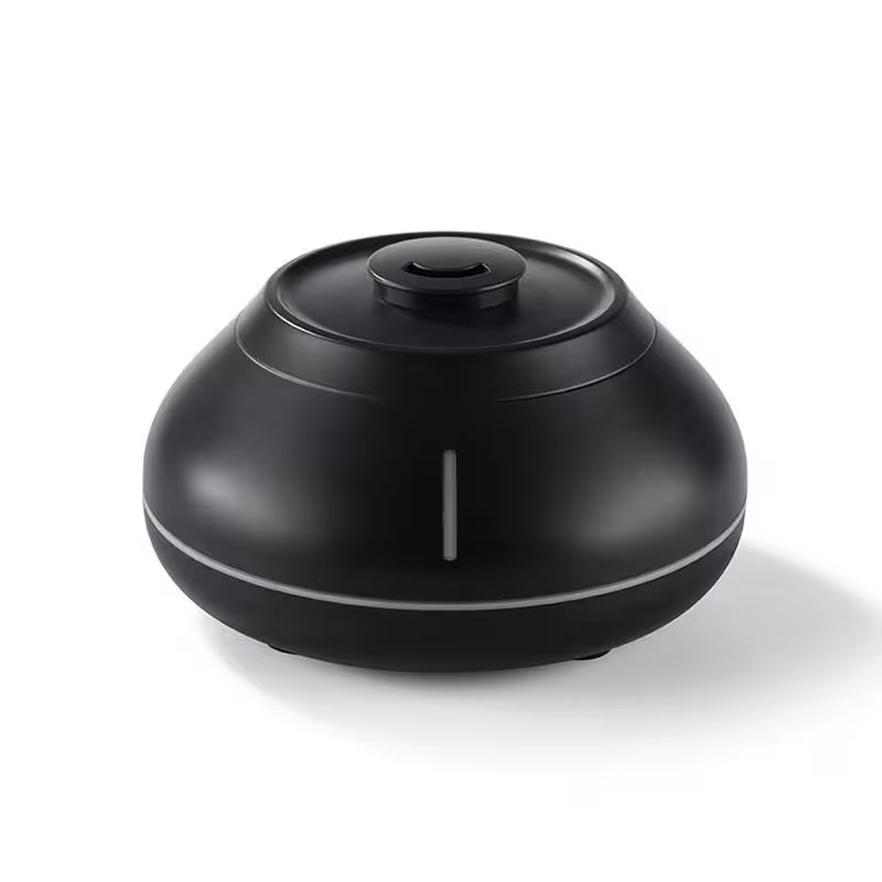 Black round humidifier on a white background