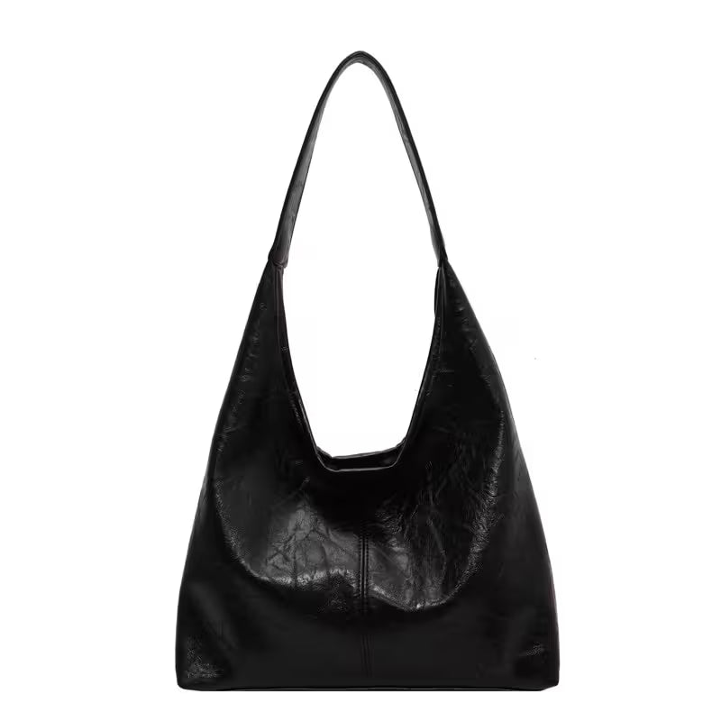 Black leather handbag on a white background
