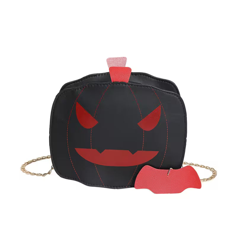 Black pumpkin-shaped bag with red face details on a white background