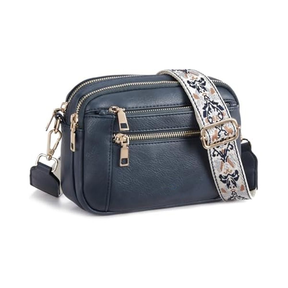 Navy blue handbag with a floral strap on a white background