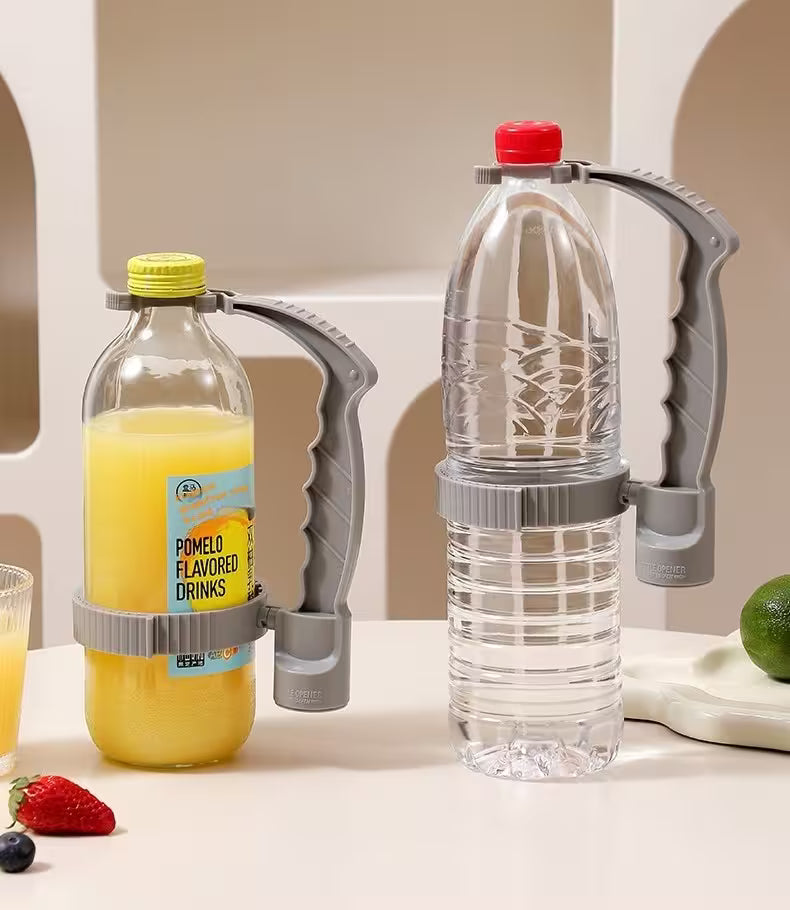 Bottle with pomelo flavored drink and a clear bottle with a red cap on a white surface.