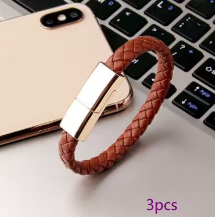 Brown braided keychain with gold clasp on a laptop keyboard