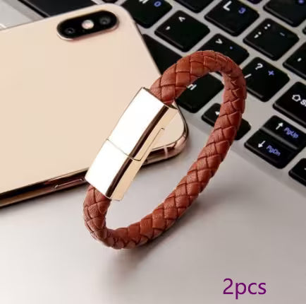 Brown braided USB drive with gold connector on a laptop keyboard