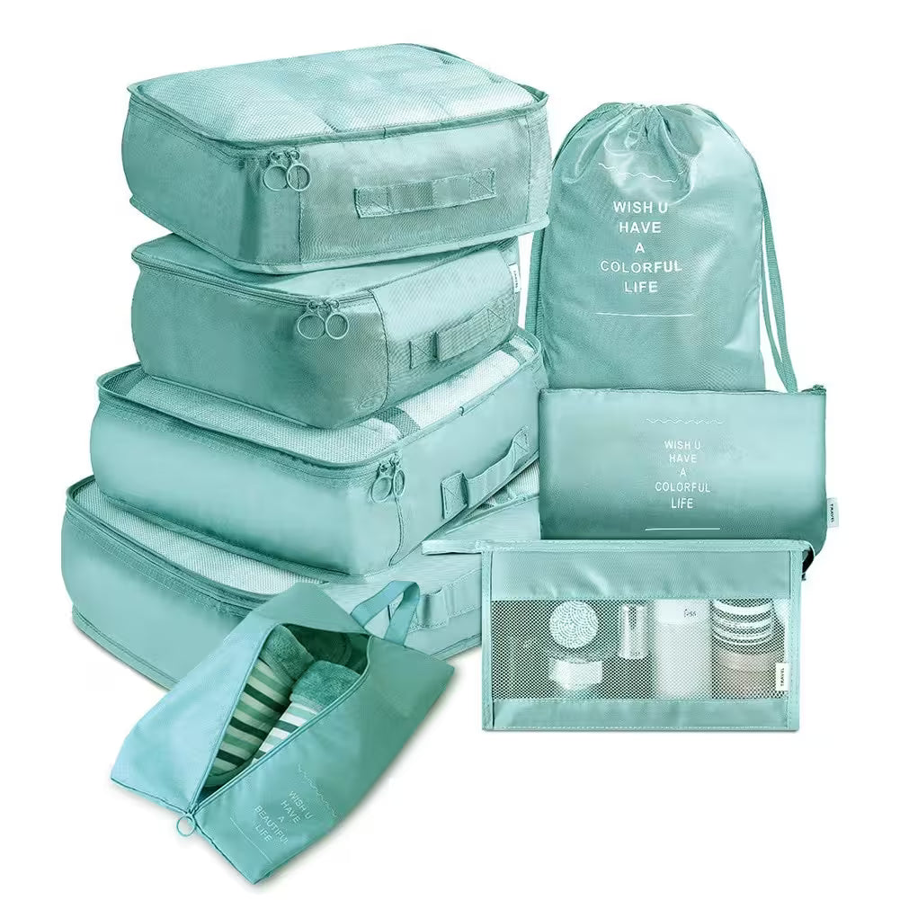 Set of teal packing cubes and bags with text on a white background