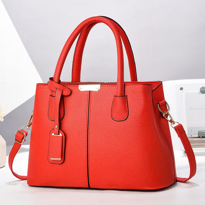 Red handbag with gold accents on a white background