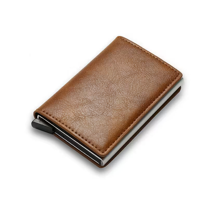 Brown leather wallet with metal clip on a white background