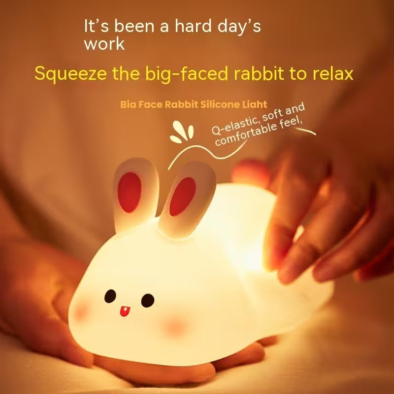 Silicone rabbit light being squeezed with text about relaxing after a hard day.