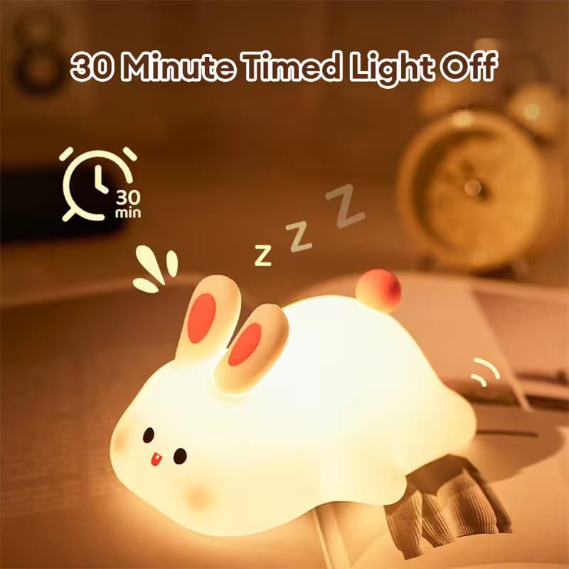 Cute rabbit-shaped night light with a 30-minute timed feature on a blurred background.