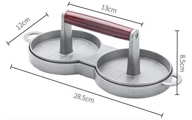 Metal cookie cutter with dimensions labeled on a white background