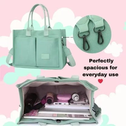 Mint green handbag with shoulder strap, open showing contents on a pink cloud background
