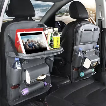 Car back seat organizer with tablet holder, drink holders, and snacks in a vehicle.