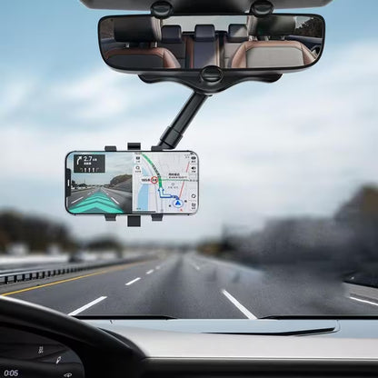 Car dashboard with a GPS device mounted on the windshield, showing a road ahead.