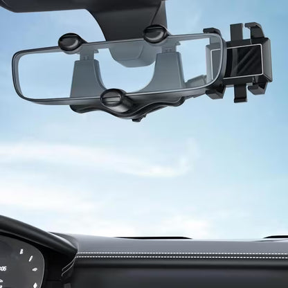 Car phone holder mounted on a car dashboard with a clear sky background