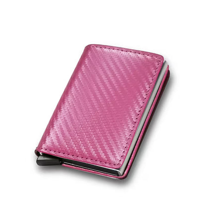 Pink cardholder with metallic finish on a white background