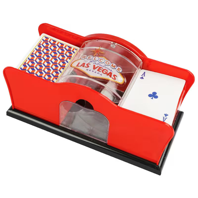 Red card holder with playing cards and a Las Vegas-themed cup on a white background