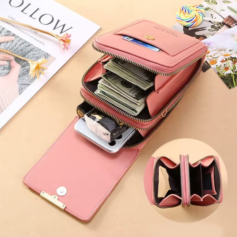 Pink wallet with compartments on a beige surface