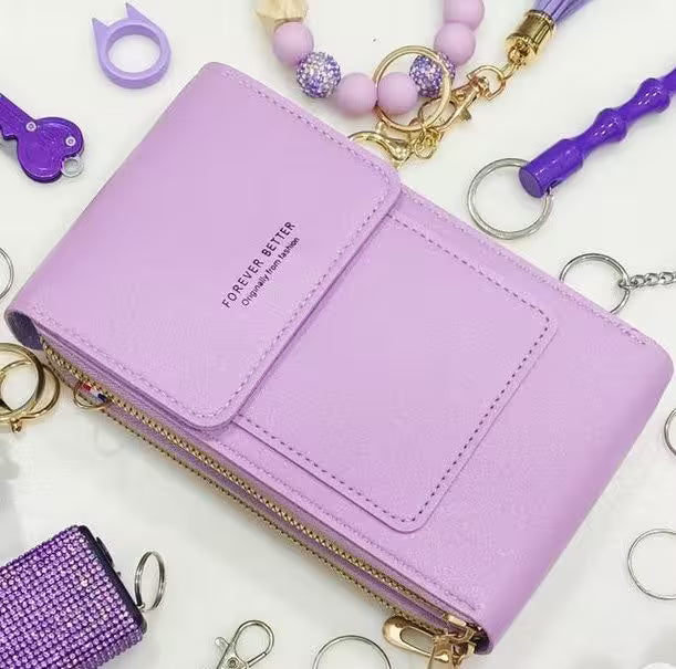 Purple wallet with 'Forever Better' text surrounded by various purple accessories on a white background