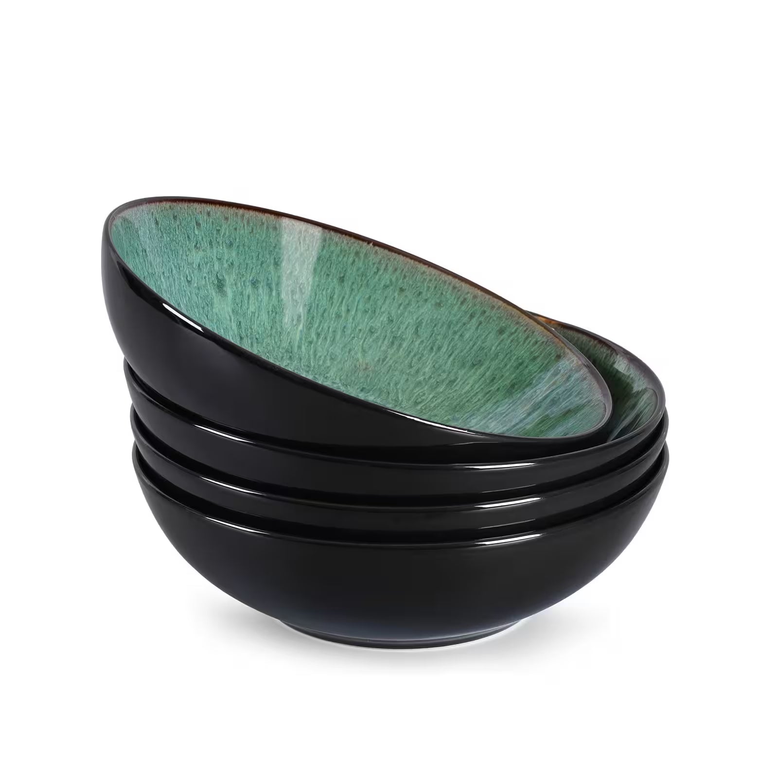 Set of three black ceramic bowls with green interior on a white background