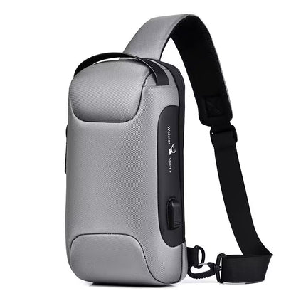 Gray sling bag with black strap on a white background