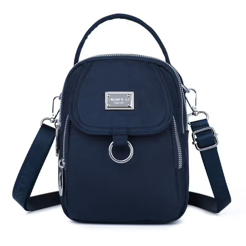 Navy blue backpack with multiple straps on a white background