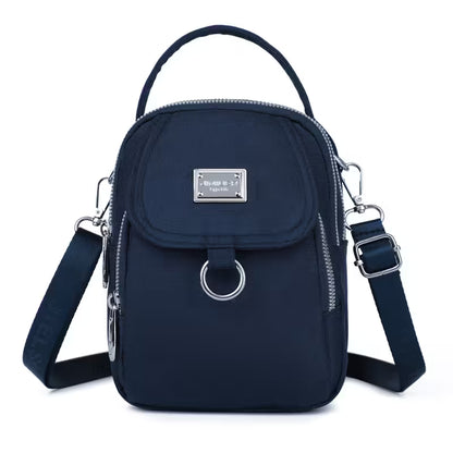 Navy blue backpack with multiple straps on a white background